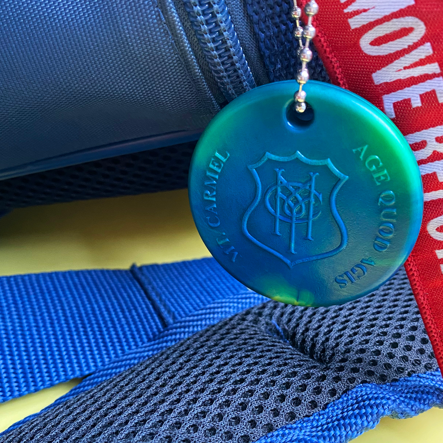 Secondary school bag tag for use with Precious Plastics machine
