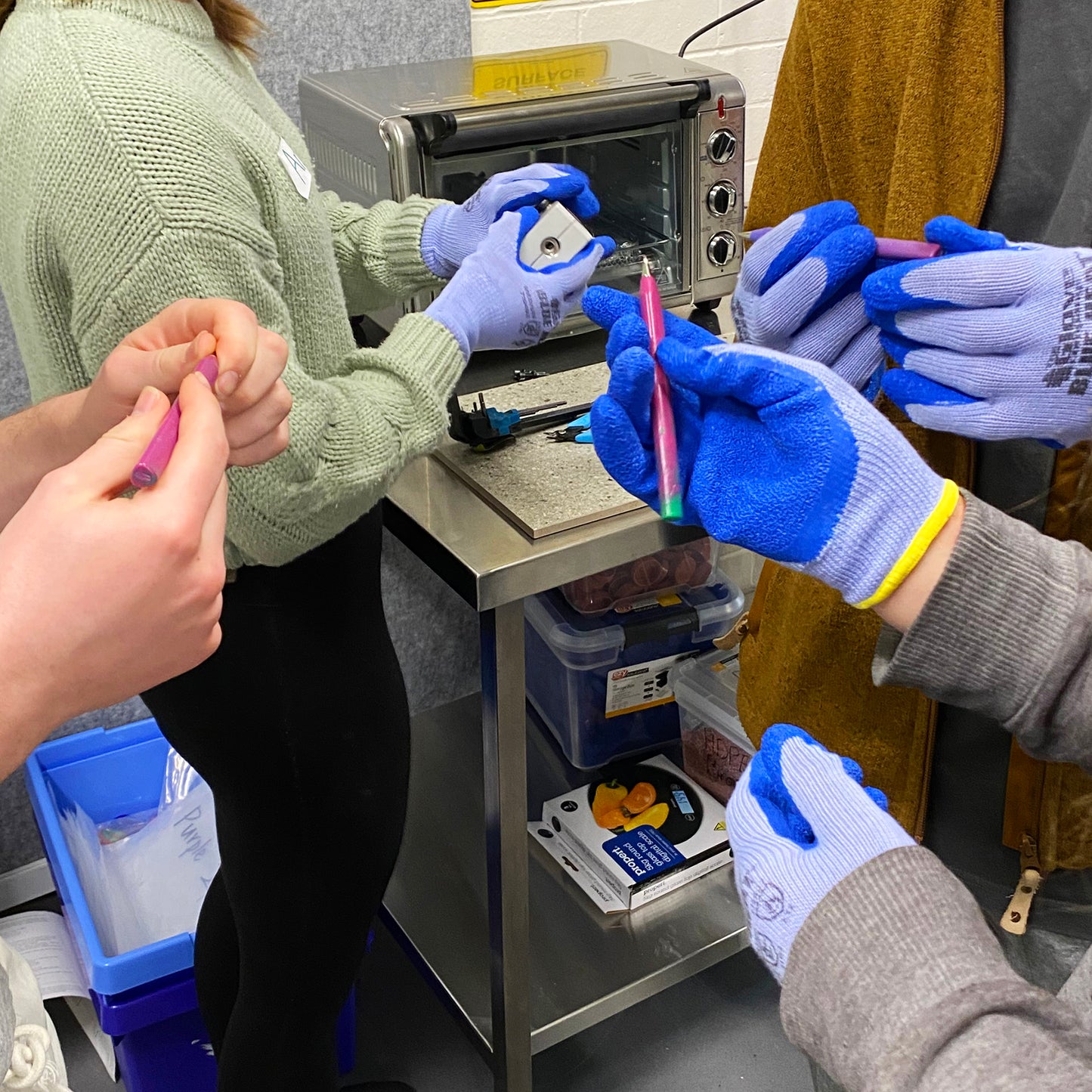 Heat proof gloves for use with plastic recycling equipment