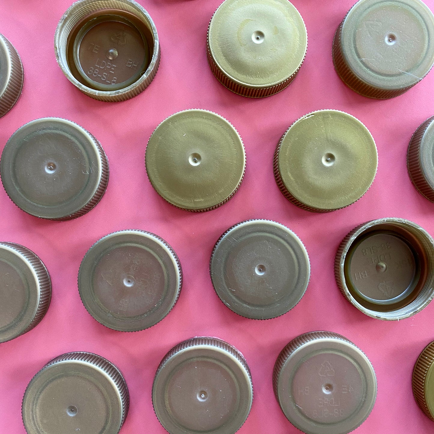 Shredded gold plastic bottle lids