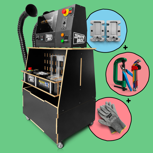 A black benchtop extruder machine with various labels such as 'in-built fume extraction', 'compact all-in-one kit', and 'mobile recycling solution'. The machine is mounted on wheels and has a pegboard and storage caddy.