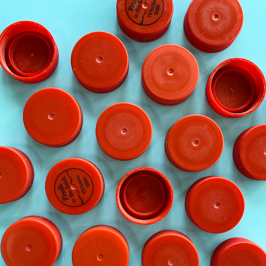 Red recycled plastic bottle lids